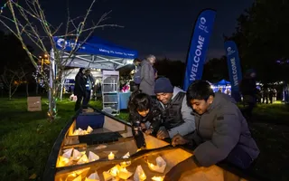 Family looking at warm light in a boat