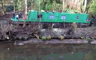 Boat left stranded on land after a flood