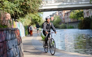 A woman cycling along Regent's Canal