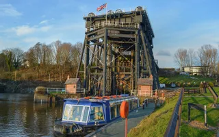 Blue boat moored beside Anderton Boat Lift