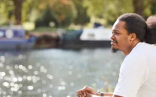 A man looking out over the canal