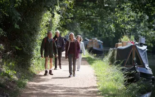 Group walking along an improved towpath