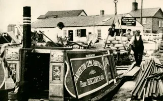 Old black and white photo of a canal boat