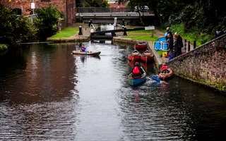 Paddlers in canoes on the canal