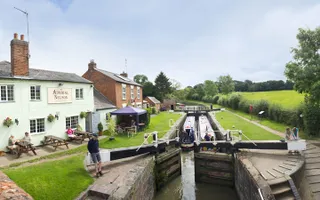 Two boats travelling through a lock