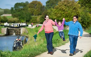 Family walking along a path at Marsworth, Grand Union Canal