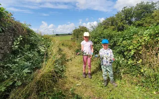 Children taking part in a gardening activity alongside the Lancaster Canal