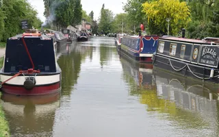 Moored boats on the Grand Union Canal at Stoke Bruerne
