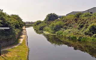 View down Daw End Branch Canal with signpost in foreground