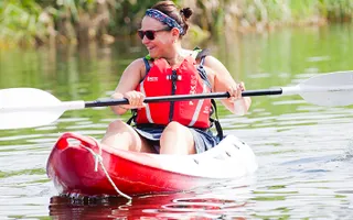 Close-up of someone paddling a kayak