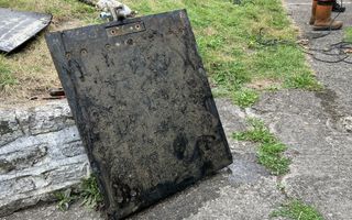 Large metal square that has been underwater for decades