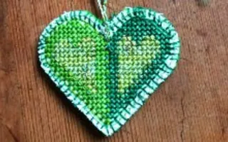Hand crafted green heart on table