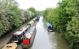 Cruising past moored boats Leicester Line Grand Union