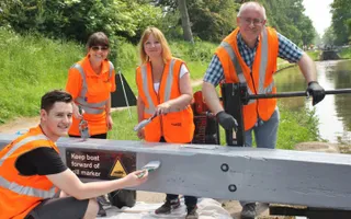 Volunteers from Network Rail paint a lock gate