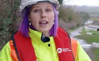 Woman in high visibility and had hat
