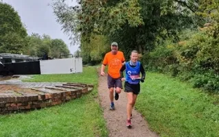Couple running along the towpath