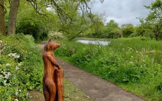 Wooden fox sculpture on the canal towpath