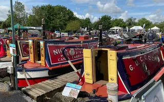 Colourful historic boats moored at Crick Boat Show