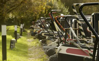 View of rear of moored boats in Welton Hyde Marina