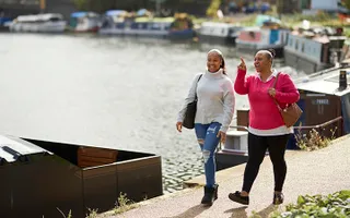 Two ladies walking along the towpath