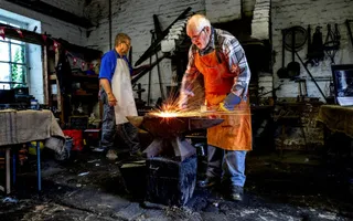 Blacksmith hammering on an anvil