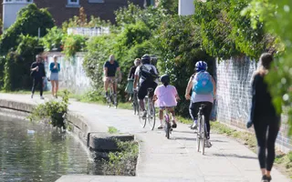 People cycling along the towpath