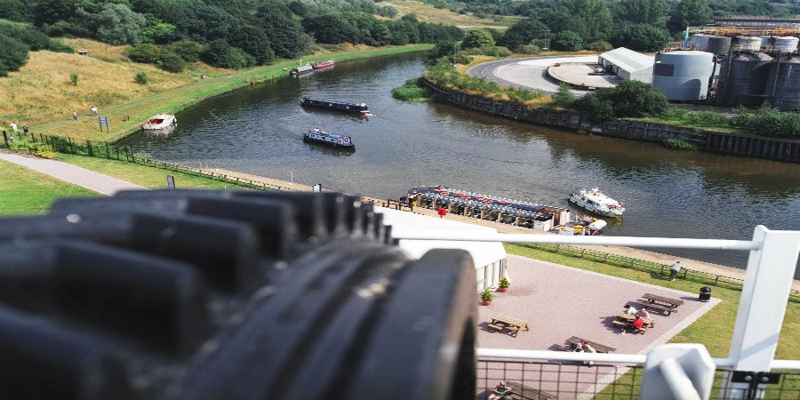 View of River Weaver from top of Anderton Boat Lift with boats on river