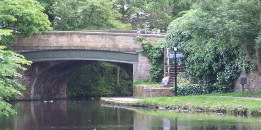 People walking across Moor Lane bridge on Lancaster Canal