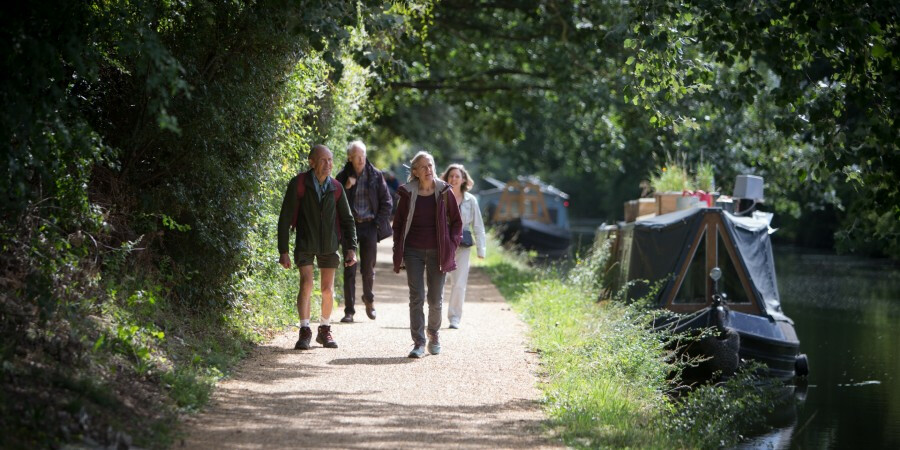 Group walking along an improved towpath