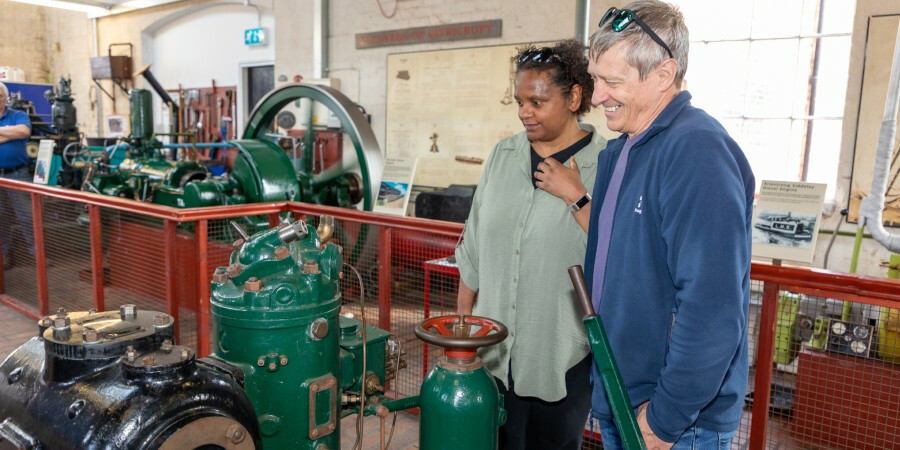 Man and woman looking at an engine in the Power Hall