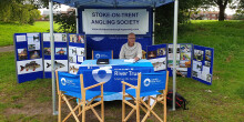 Roy Bailey of Stoke on Trent AS sitting in tent welcoming new anglers