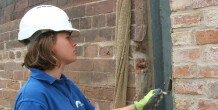 Iona helping to preserve brickwork using tools
