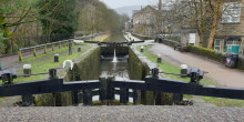 Picture of two lock gates a canal and towpath